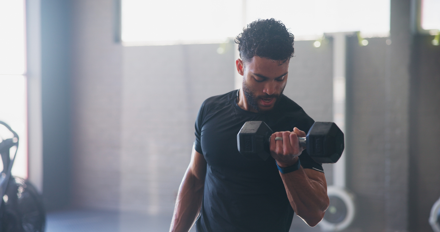 Man lifting weights in a gym
